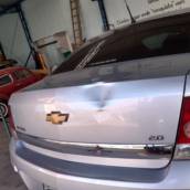 Funilaria e pintura em tampa traseira Vectra 