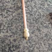 Peça para reparo em geladeira.