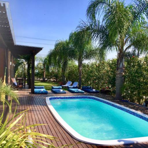 Studio Lagoa com Varanda Frente para Piscina e Jardins por Studios das Lagoas Boutique Studio Lagoa com Varanda Frente para Piscina e Jardins por Studios das Lagoas Boutique