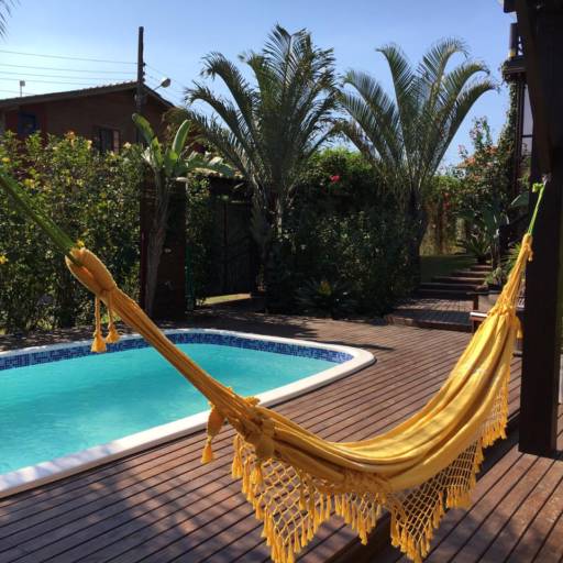 Studio Lagoa com Varanda Frente para Piscina e Jardins por Studios das Lagoas Boutique Studio Lagoa com Varanda Frente para Piscina e Jardins por Studios das Lagoas Boutique