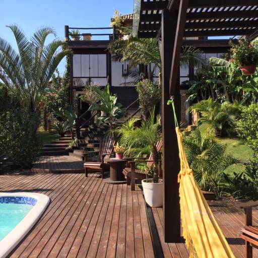 Studio Lagoa com Varanda Frente para Piscina e Jardins por Studios das Lagoas Boutique Studio Lagoa com Varanda Frente para Piscina e Jardins por Studios das Lagoas Boutique