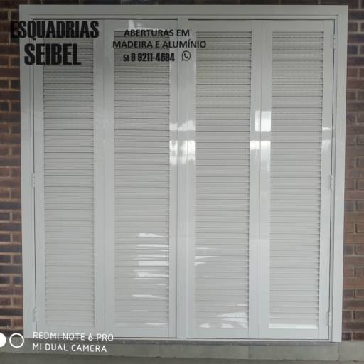 Comprar a oferta de Porta janela sanfonada italiana em Portas e Janelas pela empresa Esquadrias Seibel em Arroio do Meio, RS por Solutudo