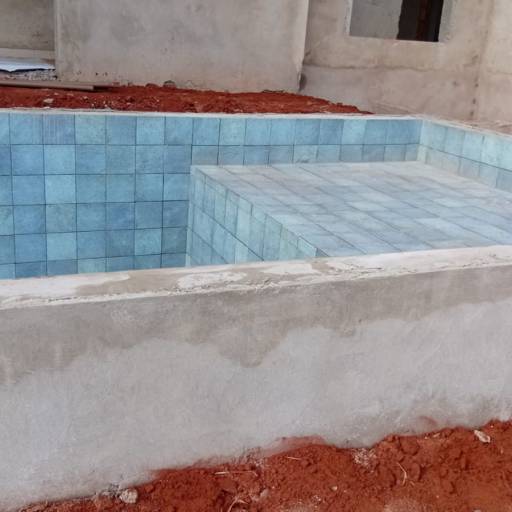 Projeto em Execução - Piscina com Prainha por Casas Riviera 