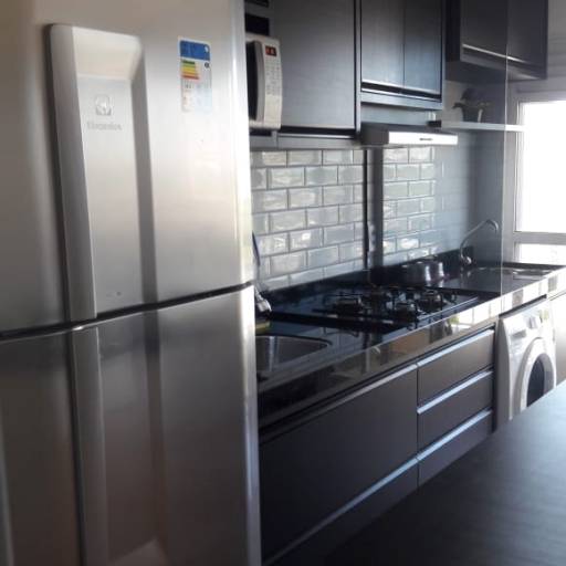 Cozinha planejada em alto padrão.  por Alexandre Elias Planejados